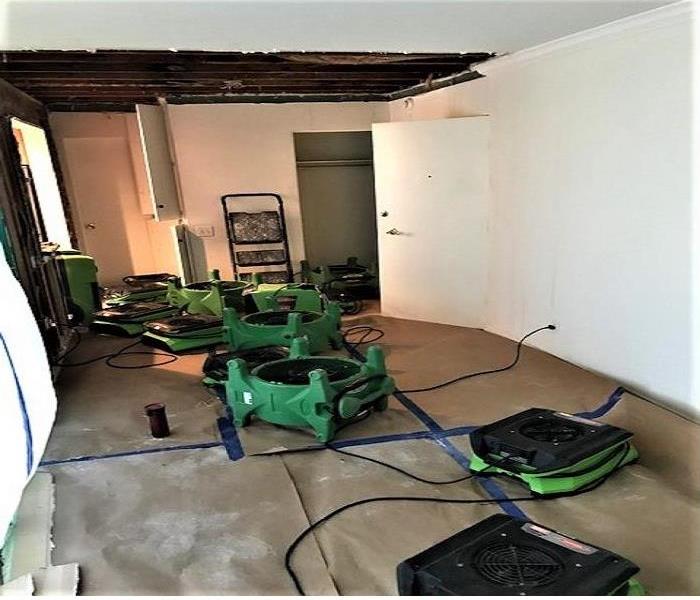 Entry way with the above cieling that has been opened for the drying process.  Rosen paper is placed on the floor to protect